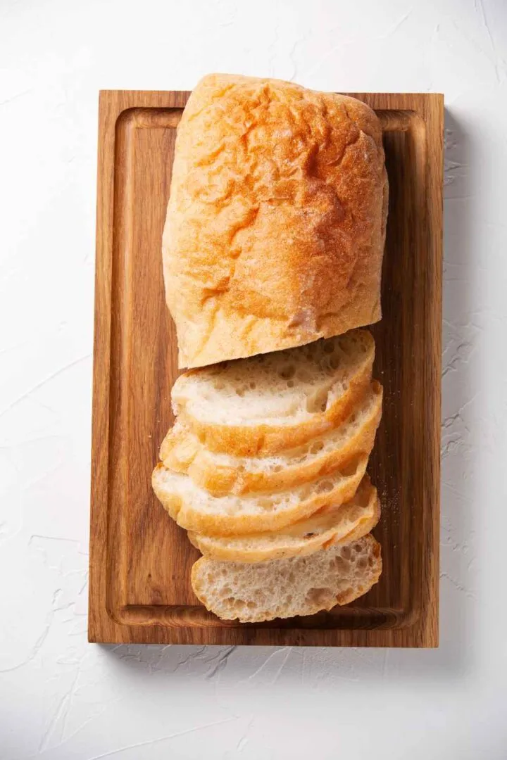 ciabatta bread cut into slices on a board